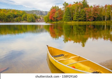 A Canoe Resting By The Calm Water In Beautiful Killarney, Ontario