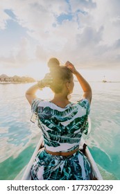 Canoe Ride In Bora Bora At Sunset