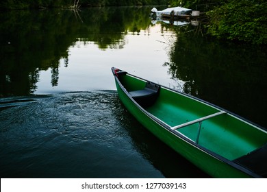 Canoe Sitting On Lake Empty