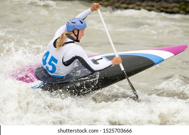 Canoe Slalom Athlete Racing On White Water