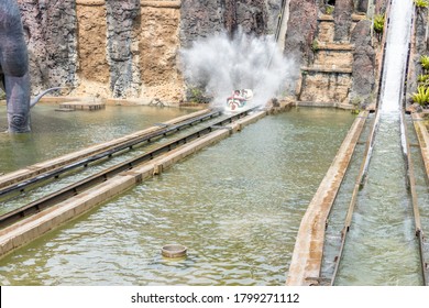 Canoe Splashing In Theme Park Water Ride