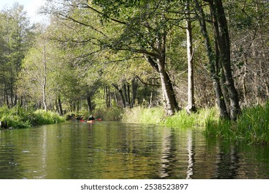 Canoe tour in autumn on the Fließen in the Spreewald with a beautiful reflection of the surroundings in the water - Powered by Shutterstock