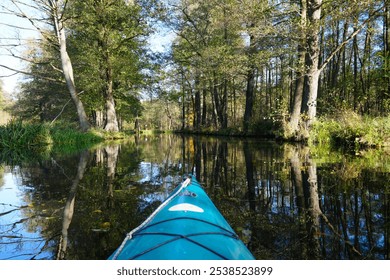 Canoe tour in autumn on the Fließen in the Spreewald with a beautiful reflection of the surroundings in the water - Powered by Shutterstock