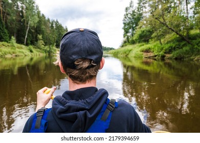 Canoeing On The Gauja River. View From The Back Of A Rower In A Life Jacket And With An Oar.