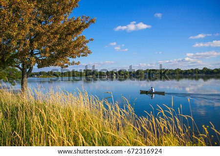 Canoeing on Lake Monona in Madison, Wisconsin as captured from Bringham Park.