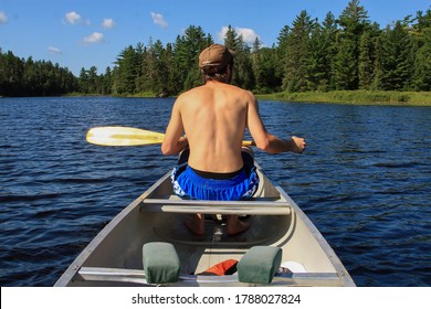 Canoeing On Lake One In The Boundary Waters Canoe Area Wilderness In Northern Minnesota.