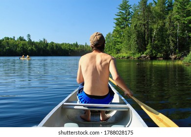 Canoeing On Lake One In The Boundary Waters Canoe Area Wilderness In Northern Minnesota.