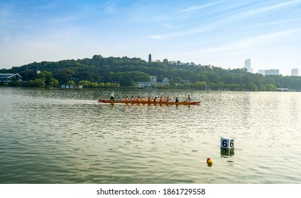 Canoeing people on the water in Xuanwu Lake, Nanjing, China - Powered by Shutterstock