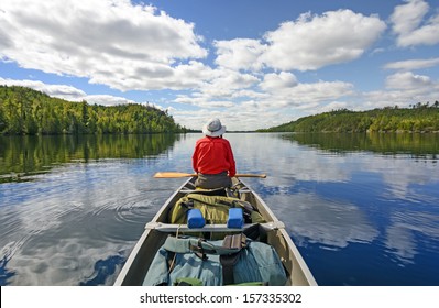 Canoer On Kekekabic Lake In The Boundary Waters In Minnesota