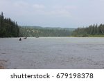 Canoes Down The River