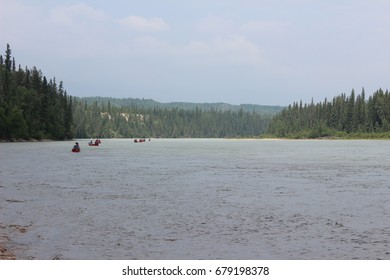 Canoes Down The River