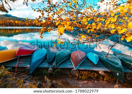 Canoes On Lake In Beautiful Fall Peak Color