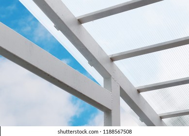A canopy made of polycarbonate against the sky.