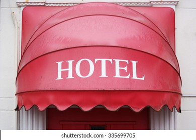 Canopy Over The Entrance. Red Hotel-sign Canopy Represents The Input.