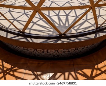 The canopy structure casts a beautiful shadow made of bamboo with an elegant shape.