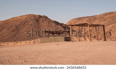 A canopy from the sun in a lifeless desert . Sinai Egypt