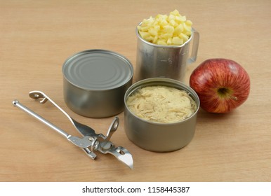 Cans Of Albacore Tuna Fish, Retro Can Opener, Red Delicious Apple And Chopped Apple In Retro Vintage Can Opener For Making Simple Tuna Fish Salad