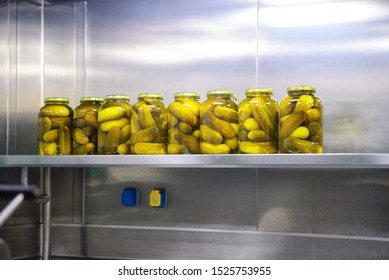 Cans of cucumbers on a shelf