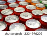 Cans of soft drink lined up ,