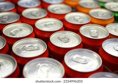 Cans of soft drink lined up ,