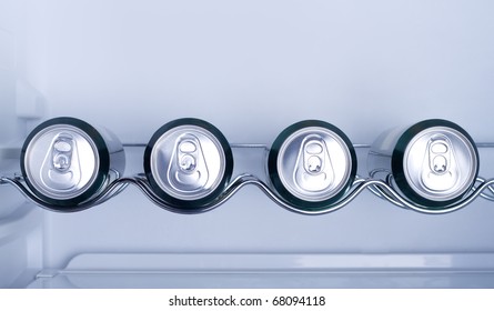 Cans Of Soft Drink In A Refrigerator