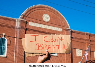 I Can't Breathe Sign Held Up In Front Of A Building.