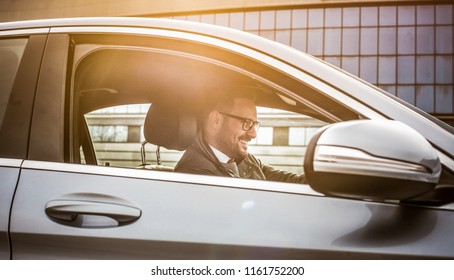  I Can't Wait To Get To Work And Start The Day Good. Young Smiling Business Man Driving Car.