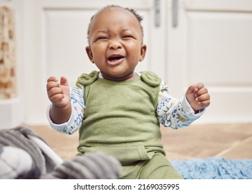 Cant We Just Cuddle All Day. Shot Of A Baby Girl Crying While Sitting At Home.