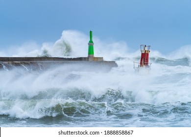 Cantabrian Sea swell in the buoy of La Barra lighthouse of San Vicente de la Barquera village located at the mouth of the harbour within Oyambre Natural Park in Cantabria, Spain, Europe