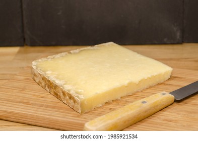 Cantal Cheese On Wooden Background