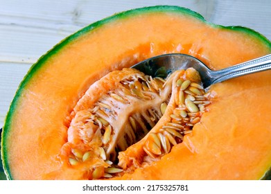 cantaloupe melon, Cucumis melo isolated , background. Favorite fruit in summer. Food, Fruits or healthcare concept. small pieces of cantaloupe melon. Japanese green melons. organic farm. vegetable art