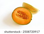 Cantaloupe melon cut in half isolated on a white background. Healthy and vegetarian food. Directly above. Copy space.