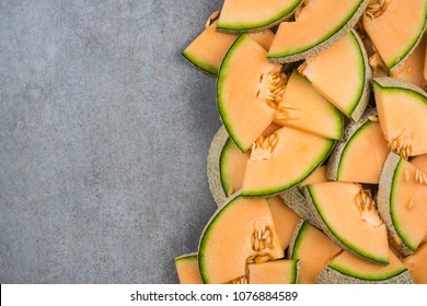 Cantaloupe melon slices, food border background, top view. - Powered by Shutterstock