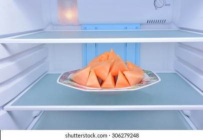 Cantaloupe In Refrigerator.