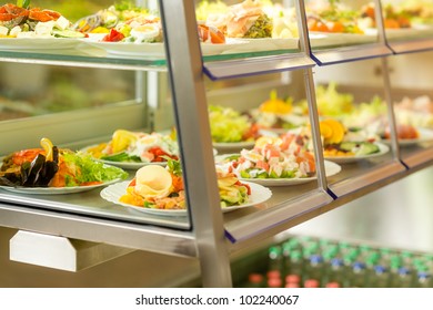 Canteen self-service food display plate with fresh made salad
