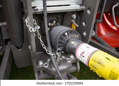 Canterbury, New Zealand, April 5 2020: The Power Take-off Unit On The Back Of A Claas Farm Tractor Showing The Safety Guard And Driveshaft 