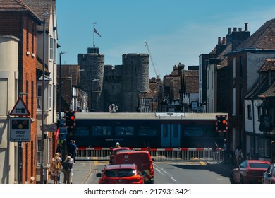 Canterbury, UK - July 16, 2022: High Speed Train Passing A Rail Crossing On Wincheap In Canterbury, Kent, UK. Westgate Is Visible In Far Background