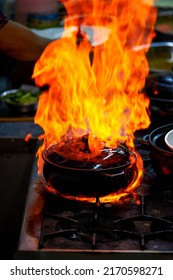 Cantonese Dishes On The Stovetop In A Kei Ke Pot Drizzled With White Wine Flames