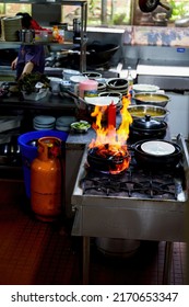 Cantonese Dishes On The Stovetop In A Kei Ke Pot Drizzled With White Wine Flames