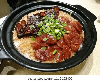 Cantonese Style Cooking Of Claypot Rice With Waxed Meats(lap Cheong). A Popular Dish During Chinese New Year Festival. Closeup.