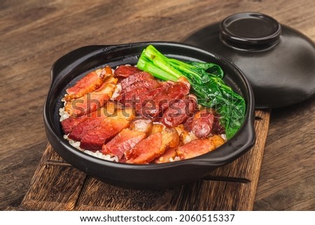 Cantonese style cooking of claypot rice with waxed meats