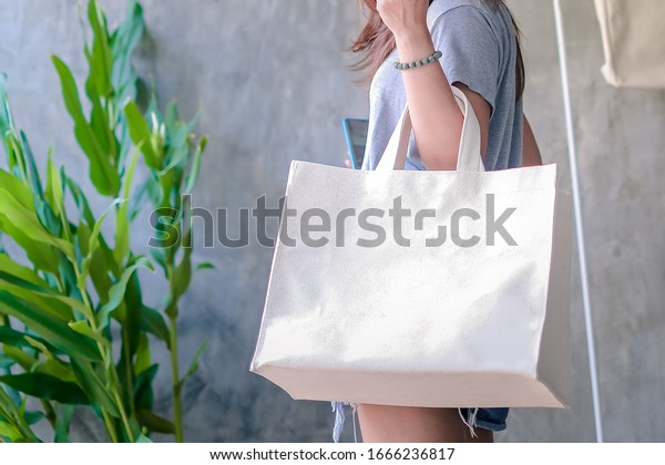 Canvas bag, Cloth bags instead of plastic\
bags in shopping for the\
environment.