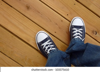 Canvas Basket Ball Shoes On Clean Wood Deck