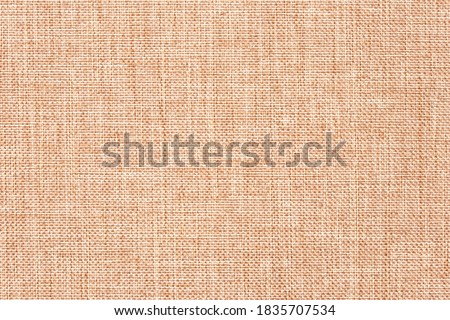 Canvas cloth, burlap, rustic home decor. Natural jute hessian, texture. Linen fabric pattern. Abstract light brown textile background. Woven wallpaper.