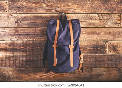 Canvas And Leather Backpack On Wooden Wall