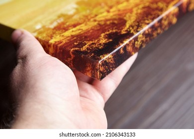 Canvas Photo Print Stretched Onto Frame With Gallery Wrap In Male Hand Closeup