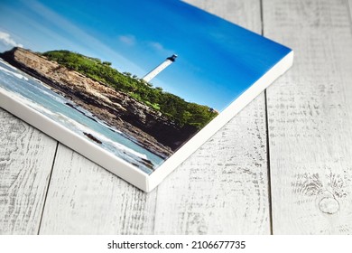 Canvas Photo Print Stretched Onto Frame With White Edge On Wooden Background