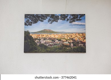 Canvas print of landscape scenery hung up on wall.