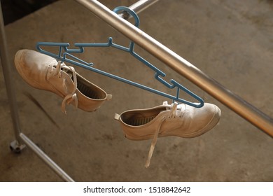 Canvas Shoes White Hanging To Dry.