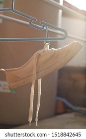 Canvas Shoes White Hanging To Dry.